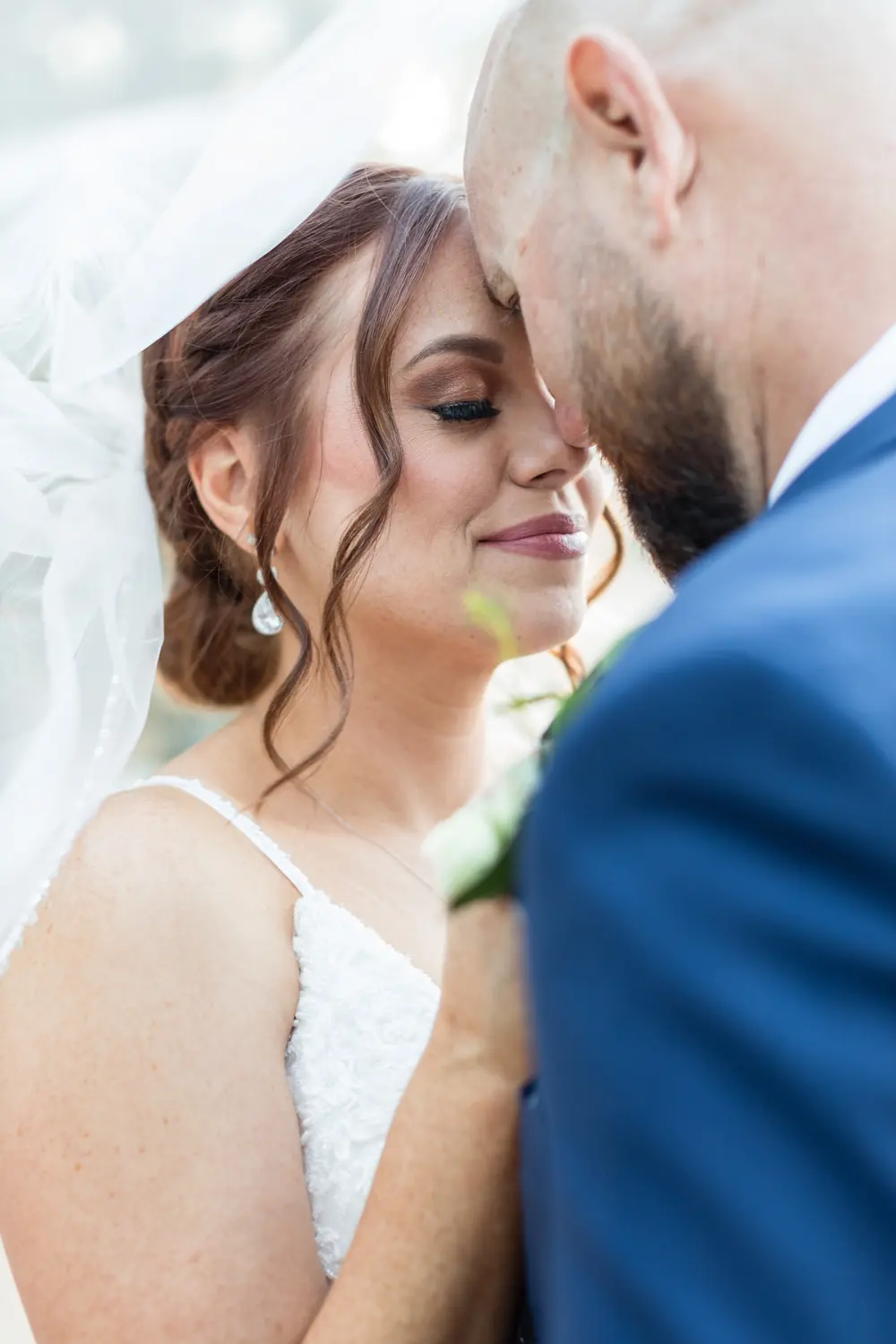 A close moment between a couple after their garden ceremony